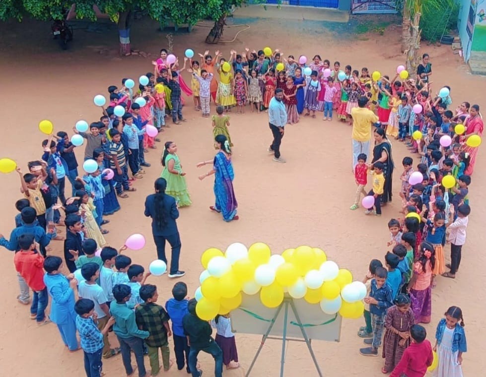Students with balloons activity